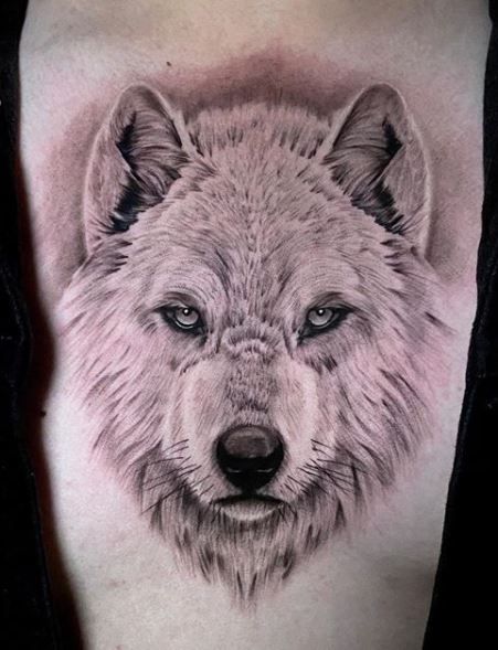 Wolf Tattoos - What's their Meaning? PLUS Ideas & Photos Black Wolf Tattoo, Wolf Eye Tattoo, Tiger Tattoo Thigh, White Wolf Tattoo, Celtic Wolf Tattoo, Howling Wolf Tattoo, Lone Wolf Tattoo, Full Chest Tattoos, Small Wolf Tattoo