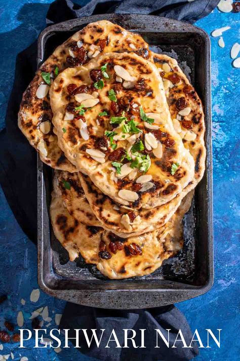 A pile of Peshwari naans in a baking dish on a blue background. Peshwari Naan Recipe, Vegetable Curry Recipes, Beef Curry Recipe, Homemade Naan, Indian Dinner Recipes, Homemade Naan Bread, Curry Recipes Easy, Recipes With Naan Bread, Naan Recipe