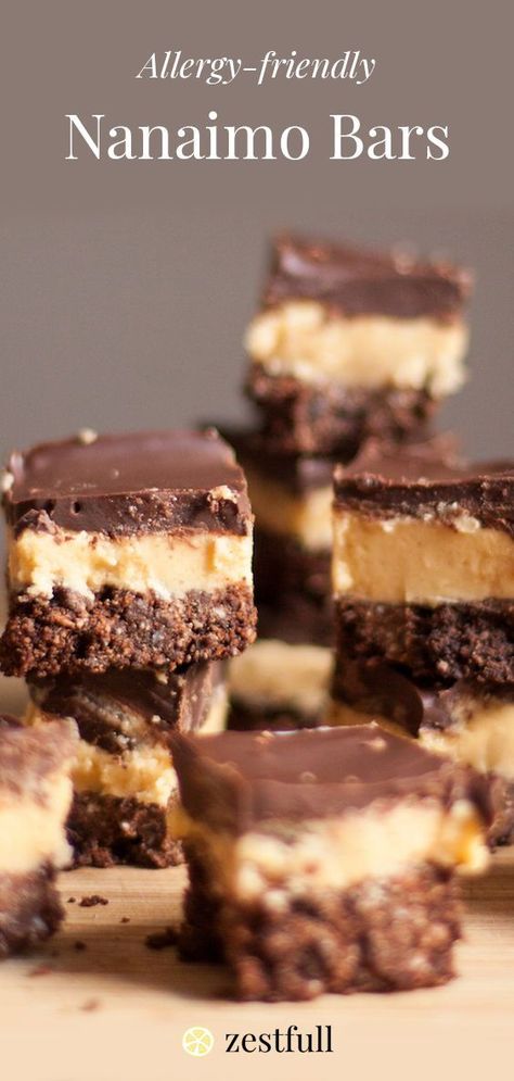 Nanaimo Bars are Canadian dessert made up of layers of chocolate graham cracker crust, custard, and chocolate. The custard is allergy-friendly. #sweetbars #dessert #nanaimobar #allergyfriendly #chocolates Peanut Free Desserts, Nanaimo Bar Recipe, Canadian Dessert, Chocolate Graham Cracker Crust, Allergy Friendly Desserts, Graham Cracker Recipes, Nanaimo Bars, Nut Free Recipes, Chocolate Crust