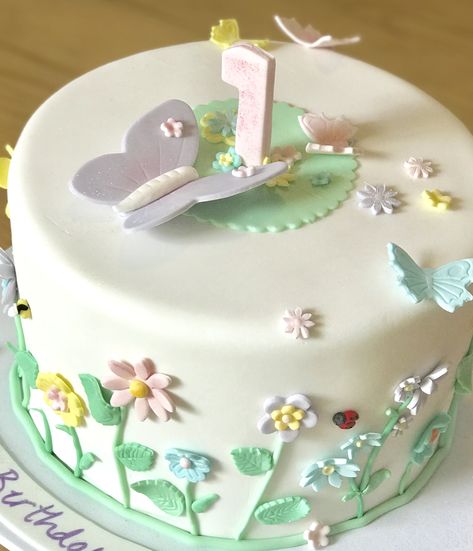 First birthday fondant butterfly garden cake Butterfly Cake One Year, Butterfly Garden Cake, Garden Party Cake, One Year Birthday Cake, Garden Birthday Cake, Fondant Butterfly, Birthday Cake Fondant, Half Birthday Cakes, Party Birthday Cake