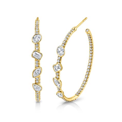 Introducing our stunning Hoop Earrings with Fancy Shape Diamonds, meticulously crafted for the perfect blend of elegance and style. Each earring features a collection of fancy-shaped diamonds, showcasing their unique beauty. Set in a secure and modern bezel setting, these earrings offer a contemporary twist on a classic design. Fancy Hoop Earrings, Diamond Drop Earrings Simple, Jewellery Advertising, Rings Opal, Diamond Earrings Design, Diamond Choker Necklace, Diamond Huggies, School Jewelry, Fine Diamond Jewelry