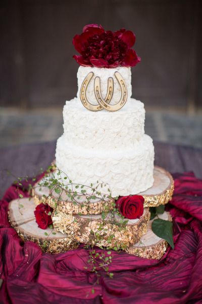 Horse shoes and a bit of rustic flair: http://www.stylemepretty.com/california-weddings/santa-barbara/2014/12/22/equestrian-winter-wedding-inspiration/ | Photography: Jessica Lewis - http://www.jessicalewisphoto.com/ Red Quince Centerpieces Charro, Charro Cakes, Charro Wedding, Charro Theme, Mexican Wedding Cake, Quince Cakes, Quince Cake, Equestrian Wedding, Mexican Quinceanera Dresses