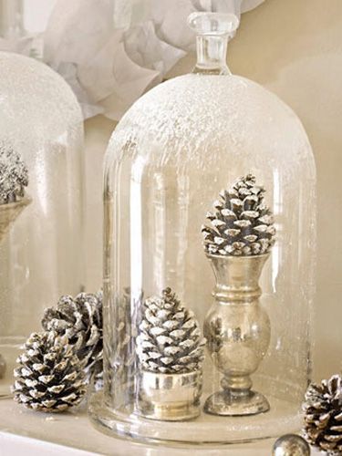 A few light spritzes of fake snow turn these pinecones into frosty works of art. When they're perched underneath glass cloches misted with the same icy spray, the entire scene resembles an ultra-refined snow globe. Winter Wedding Centerpieces, Eco Christmas, Christmas Tablescape, Pine Cone Decorations, Cones Crafts, Pine Cone Crafts, White Christmas Decor, Christmas Fireplace, Noel Christmas