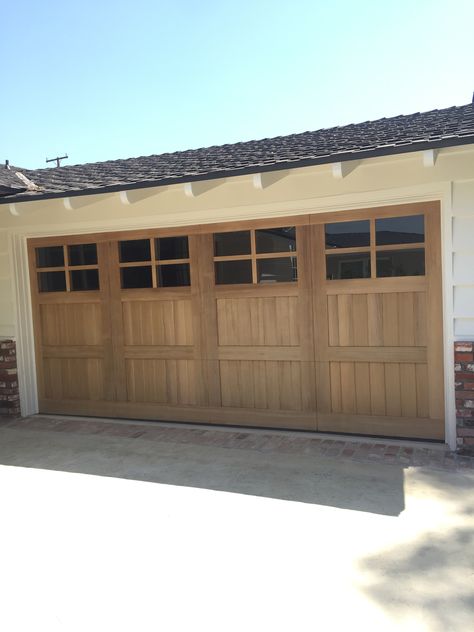 Cedar garage door Wood Garage Door With Windows, Wood Stained Garage Doors White House, Light Wood Garage Door, Wood Look Garage Doors With Windows, Chi Cedar Garage Doors, Garage Doors Wood, Real Wood Garage Door, Ranxh House Wood Garage Door, Oak Garage Doors