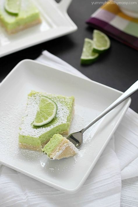 If you like lemon bars, you will love these lime bars! The crust is delicious. The lime layer is divine, light and fluffy, almost like a meringue but full of lime flavor. And the green is perfect for St. Patrick's Day! Recipe @yummyhealthyeasy American Dessert Recipes, Desert Bars, Orange Stuff, American Dessert, Citrus Desserts, Lime Slice, Lime Desserts, Layer Bars, Delish Desserts