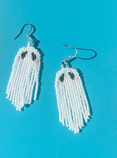 Handbeaded  ghost earrings! Made with glass Miyuki beads. *IMPORTANT* store you fringe earrings on a earring rack or flat with all the fringe in place, if the earrings are stored with the fringe not laying correctly the earrings can get stuck in that position and not lay correctly! made slowly in Seattle. Handle with love and care! Ghost Seed Bead Earrings, Ghost Beaded Earrings, Beaded Ghost Earrings, Beaded Ghost, Halloween Jewellery, Earring Rack, Fringe Earring, Beaded Jewelry Earrings, Beaded Earrings Tutorials