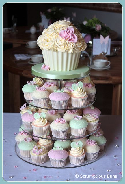 I love this idea, then use the top cupcake as the smash cake. Summer Wedding Cupcakes, Chocolate Giant Cupcake, Cake With Cupcakes, Giant Cupcake Cakes, Cupcake Tower Wedding, Swirl Cupcakes, Gateau Baby Shower, Spring Wedding Cake, Cupcakes Birthday