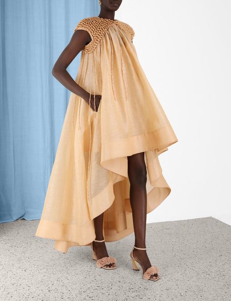 The Coaster Embellished Gown in Sand from our Spring 2023 Collection, Wonderland. A silk linen gown featuring a full asymmetric skirt hand stitched shells throughout. Cute Lounge Outfits, Linen Gown, Afro Fashion, Lounge Outfits, Maternity Photoshoot Outfits, African Print Maxi Skirt, Genderless Fashion, African Fashion Skirts, Asymmetric Skirt