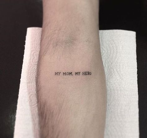 "My Mom, My Hero" quote tattoo on the arm | www.otzi.app My Dad My Hero Tattoo, 1999 Tattoo, Quote Tattoos Girls, Tatuagem Masculina Pequena, Small Chest Tattoos, Quote Tattoo, Elbow Tattoos, Mother Tattoos, Inspiration Tattoos