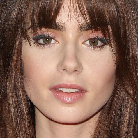 Lily Collins Makeup: Black Eyeshadow, Nude Eyeshadow & Nude Lipstick | Steal Her Style Layered Hair With Bangs, Long Brunette Hair, How To Cut Bangs, Face Shape Hairstyles, Hair Styles 2014, Fringe Hairstyles, Long Hair With Bangs, Auburn Hair, Haircuts For Long Hair