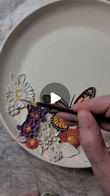 Kelsey Schroeder on Instagram: "Adding underglazes to sculpted wildflowers and monarch butterfly plate 🦋 💐  . . . . . . #monarch #monarchbutterflies #wildflowers #butterfliesandflowers #butterflies #butterflypottery #monarchpottery #kswildlifecreations #wildflowerpottery #ceramicartist #clayartist #painting #process reels #potteryprocess #artistatwork" Monarch Butterfly, Painting Process, Dry Clay, Ceramic Artists, Artist At Work, Air Dry, Wild Flowers, Butterflies, Glaze