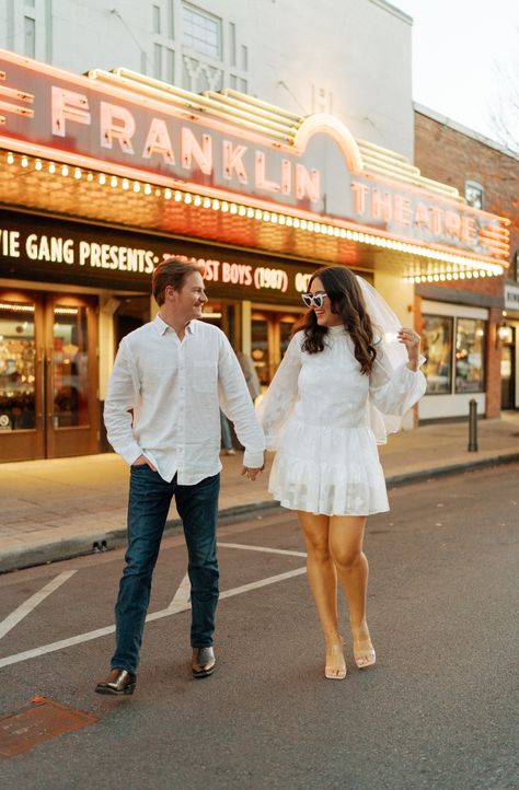 This is a picture of a couple taking engagement pictures in front of the Franklin Theatre in Franklin, TN Engagement Photos Nashville Tn, Franklin Tennessee Aesthetic, Nashville Engagement Photos, Engagement Portraits Poses, Nashville Broadway, Portraits Poses, Franklin Tennessee, Photography Trends, Couple Picture