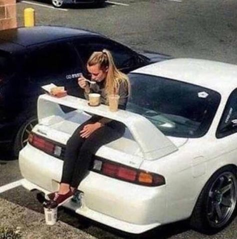 Girl eating lunch on a car spoiler Jdm Girls, Glass Wall Lamp, Foto Top, Best Jdm Cars, Street Racing Cars, Street Racing, 웃긴 사진, Japan Cars, Pretty Cars