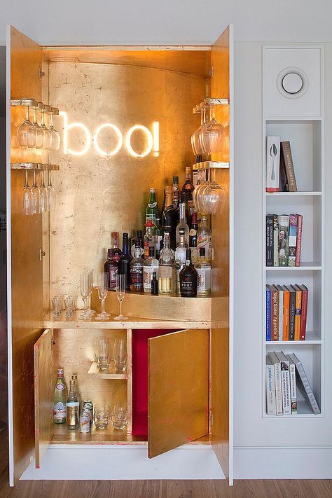 Gold leaf sheets and illuminated sign for the wardrobe home bar [Design: MATT Architecture] Ideas De Mini Bar, Small Bar Ideas, Small Home Bar Ideas, Home Mini Bar, Small Bars For Home, Bar Mini, Home Bar Rooms, Modern Home Bar, Home Bar Sets