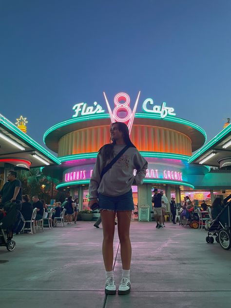 girl in front of V8 diner at Cars Land Disneyland Balloons Pictures, Disneyland Ride Pictures, Universal Inspo Pics, Disneyworld Aesthetic Pics, Disneyland Senior Pictures, Disney California Adventure Photo Ideas, Disneyland Instagram Pictures, Pictures At Disneyland, Disneyland Picture Ideas