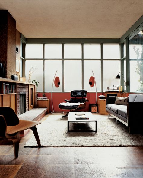 A bank of translucent glass windows diffuses light evenly in the Farnham-Rice residence. The storied Victorian was originally built in 1908 and underwent a 1947 renovation by Henry Hill. In 2005, Gretchen Rice and Kevin Farnham moved in and brought with them their collection of vintage design.  Photo by: Misha Gravenor  Read more: http://www.dwell.com/slideshows/mid-century-modern-homes-dwell-magazine.html?slide=11=y=true#ixzz1zbUBBAkn Mid Century Renovation, Mid Century Living, Mid Century Living Room, Mid Century Modern Living, Mid Century Modern Living Room, Eames Chairs, Mid Century Modern House, A Living Room, Mid Century House