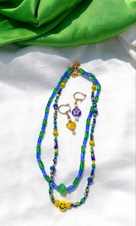 Smiley necklace with blue, green and yellow pops of colour! Ideal for summer, handmade 💙😁 Millefiori earrings to match! Smiley Necklace, Bead Diy, Small Circle, Bead Jewellery, Green And Yellow, Diy Beads, Smiley, Diy Jewelry, Color Pop