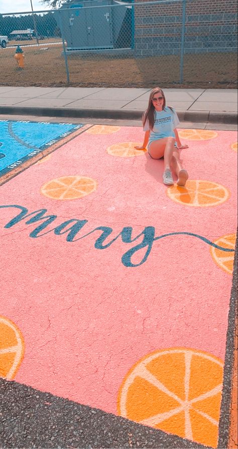 Pink background with yellow lemons and cursive navy name at bottom Simple Parking Spot Painting Ideas, Simple Parking Spot Painting, Cute Parking Spot Painting Ideas, Highschool Parking Spot Ideas, Painted Parking Spaces Ideas, Senior Parking Spot Painting, Senior Year Planning, Parking Lot Painting, Fun Chalk Art