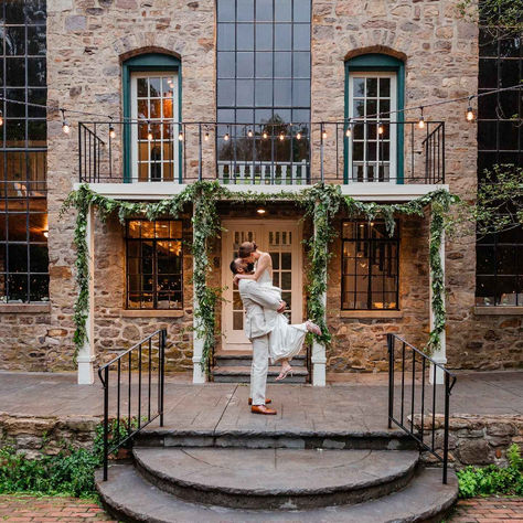 Groom lifts bride off feet at historic Bucks County wedding venue HollyHedge Estate decorated with garland Holly Hedge, Wedding Outside, Beautiful Wedding Venues, Bucks County, River House, County Wedding, Garland Decor, New Hope, Estate Wedding