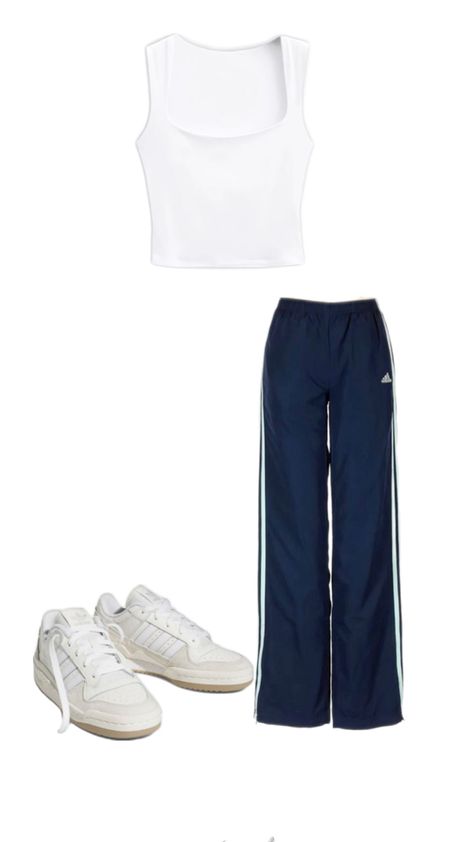 Embrace the sporty chic vibe with this effortlessly cool outfit! Navy Adidas track pants offer a comfortable yet stylish fit, paired with a simple white crop tank for a fresh, clean look. Complete the outfit with crisp white Adidas Forums to tie it all together. Perfect for running errands, lounging, or casual outings, this ensemble combines athletic wear with street style for the ultimate laid-back yet trendy look. #SportyChic #AdidasTrackPants #CropTank #AdidasForums #StreetStyle #Athleisure #CasualOutfit #OOTD Adidas Forums, Adidas Track Pants Outfit, Street Style Outfits Casual, Track Pants Outfit, Outfit Navy, Navy Adidas, White Crop Tank, Cool Outfit, Adidas Track Pants