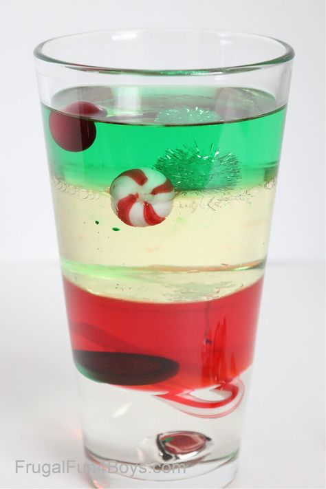 Christmas Density Tower Science Experiment - Frugal Fun For Boys and Girls Santa Science Experiment, Christmas Science Experiments For 3rd Grade, Fun Christmas Science Experiments, Preschool Christmas Science Experiments, Density Tower Experiment, Elf Science Activities, Christmas Science Experiments For Middle School, Melting Christmas Tree Experiment, Grinch Science Experiments