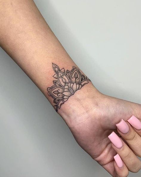 20 Sweet Wrist Tattoos For Women To Enhance Your Femininity 1 Tatoos Woman Hand Mandala, Forearm Henna Tattoo Women, Half Cuff Tattoo, Mandala Wrist Tattoos For Women Cover Up, Mandela Tattoo Wrist, Mandala Flower Wrist Tattoo, Geometric Wrist Tattoos For Women, Mandala Tattoo Women Arm, Mandala Tattoo Wrist For Women