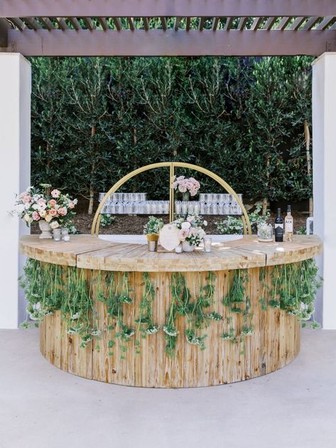 Fairytale garden bar inspiration! Round wooden bar with hanging greenery was perfectly lowkey but gave us all a woodsy feel Bar Backyard Wedding, Semi Circle Bar, Bar Backyard, Hanging Greenery, Fairytale Garden, Circle Bar, Bar Inspiration, Lady Liberty, Round Bar