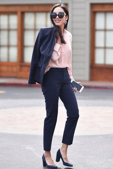 a navy pantsuit with cropped pants, a pink shirt and blue shoes for a professional look Navy Heels Outfit Work, Black Pants Pink Top Outfit, Pink Shirt Black Pants Outfit, Navy Shoes Outfit, Navy Pants Outfit Work, Black Pants Outfit For Work, Professional Office Outfit, Fashionable Work Outfits, Comfortable Work Clothes