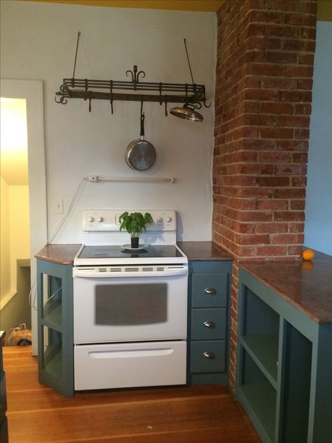 Kitchen Green Walls, Exposed Chimney, Kitchen Corner Cabinet Ideas, Kitchen Chimney, Kitchen Green, Corner Kitchen Cabinet, Pot Racks, Brick Chimney, Ideas For Kitchen