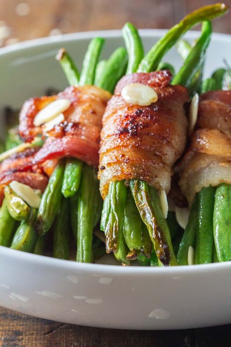 Bacon Wrapped Green Beans are the most PERFECT quick and easy stove-top side dish. Leave the oven free for the main dish and dessert by making these bundles in a pan! #greenbeans #bacon #sidedish #thanksgiving #christmas #easysidedish #ad Holiday Vegetable Dishes, Thanksgiving Recipes Side Dishes Veggies, Turkey Side Dishes, Thanksgiving Vegetable Sides, Green Bean Bundles, Bacon Wrapped Green Beans, Thanksgiving Side Dishes Healthy, Thanksgiving Vegetables, Dinner Thanksgiving