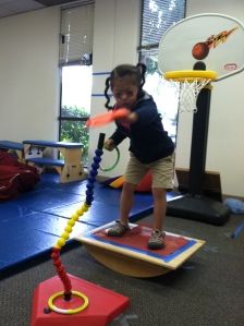 Ideas for using a balance board~ this looks like a fun way to have M work on reducing the tightness in his tendons. I think I'll be getting him one! Vestibular Activities, Adapted Pe, Pediatric Pt, Sensory Motor, Pediatric Physical Therapy, Occupational Therapy Activities, Motor Planning, Vision Therapy, Pediatric Occupational Therapy