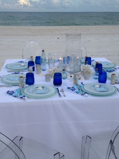 mediterranean dinner party decor. white table cloth with different blue tints. coral pieces for table decor. Mediterranean Dinner Party, Greek Party Decorations, Modern Mediterranean Decor, Mediterranean Party, Greece Party, Greek Dinner, Greek Theme, Mediterranean Dinner, Greek Party