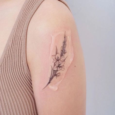 Gladiolus Rib Tattoo, Gladiolus Flower Tattoo Design, Gladiolus Flower Tattoo Small, Tattoos Lily Of The Valley, Goat Tattoo Ideas, Poppy And Gladiolus Tattoo, Gladiolus Tattoo Simple, Gladiolus Tattoo Design, Gladiolus Tattoos