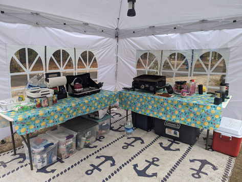 This kitchen camp set up is perfect for big groups!!! Everything is covered from flies and shaded, and it has enough space to lay everything out neatly. Looks like there is a Blackstone grill and Coleman propane grill so anything is possible to be cooked here! YUM! Photo Credit: Lauren Gramolini Tent Camping Set Up, Camp Set Up Ideas, Camp Set Up, Camping Set Ups, Camping Kitchen Set Up, Campsite Setup, Camping Tricks, Set Up Ideas, Camping Hacks Food