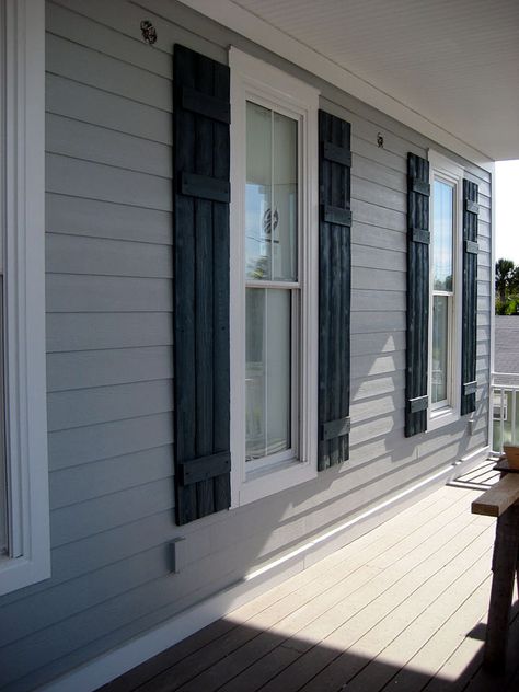 dark blue-green shutters Gray House Black Shutters, Front Door Gray House, Siding Combinations, Navy Blue Front Door, Outdoor Window Shutters, Cottage Shutters, Shutters Living Room, Black Cottage, Painted Houses