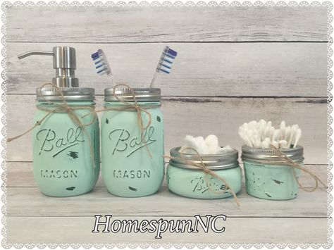 HomespunNCs Mint Mason Jar Bathroom Décor sets add a touch of rustic chic to any bathroom! These Mason Jars function as a multi-purpose organization and décor set and can be utilized in any room of your home or office. These sets make for thoughtful wedding and housewarming gifts, too! (Other set & color options are available in my shop)  Mint 6 piece set includes: 1 Quart Size Mason Jar Vase 1 Pint Size Mason Jar Stainless Steel Soap Dispenser 1 Pint Size Mason Jar Toothbrush Holder 1 H... Bathroom Decor Coastal, Rustic Farmhouse Bathroom Decor, Mason Jar Bathroom Decor, Mason Jar Toothbrush Holder, Coastal Bathroom Decor, Distressed Mason Jars, Rustic Farmhouse Bathroom, Quart Size Mason Jars, Gray Bathroom Decor