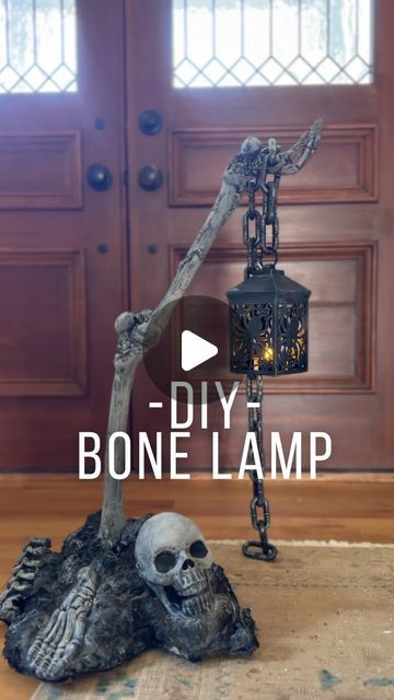 Mary Beth Wilhelm on Instagram: "DIY SKELETON BONE LAMP POST??? 🤣 🖤 ☠️ 🦴🔥 
Most materials used are from The Dollar Store!!! The loctite ($6.96) and spray paint ($5.98) were the most expensive materials for me. I had the styrofoam, paint and the bones. And again, Dollar stores and Walmart carry them if needed. 

Materials:

Plastic LIGHTWEIGHT skeleton bones. 
Lantern 
Chain 
Loctite
A box or styrofoam for your base
Black spray paint 
Black acrylic paint" Bones Halloween Decor, Halloween Bones Decorations, Dollar Store Skeleton Ideas, Halloween Chains Decor, Halloween Styrofoam Crafts, Diy Bone Decor, Diy Skeleton Lamp, Halloween Prop Diy, Halloween Arch Diy