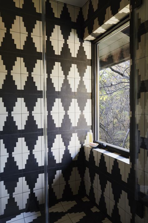 Graphic black and white cement tile was added in the renovation. Bathroom Black And White, Exquisite Surfaces, Cement Tile Floor, Stone Tile Wall, Hudson Homes, Bathroom Black, Cement Tiles, New Rock, Cement Tile