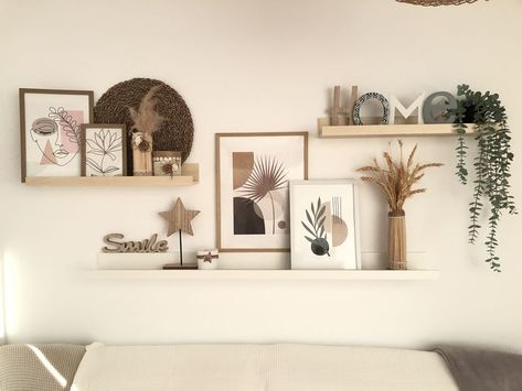 28 Best Wall Decor Ideas To Decorate Your Blank Wall - Foyr Welcome Home Wall Decor, Three Shelves Above Couch, Picture Shelf Aesthetic, Floating Shelves Living Room Over Couch, Floating Shelves With Frames, Decoration Wall Living Room, Walls With Shelves Living Room, Three Shelves On Wall, Lounge Wall Shelf Ideas