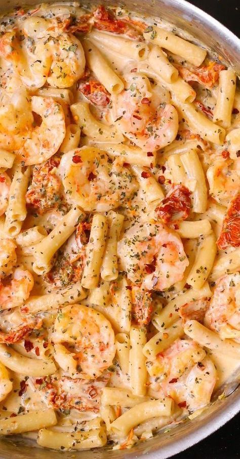 Shrimp Pasta in a deliciously creamy and cheesy Mozzarella sauce.  This easy weeknight dinner is made completely from scratch with sun-dried tomatoes, basil, and red pepper flakes. #shrimppasta #shrimp #pasta #seafood #dinner #Italianpasta #Italiandinner #Italianfood #creamypasta #creamyshrimppasta #recipe Mozzarella Sauce, Pasta Shrimp, Creamy Shrimp Pasta, Mozzarella Pasta, Resep Pasta, Recipe Shrimp, Pasta Cremosa, Pasta Italiana, Basil Pasta