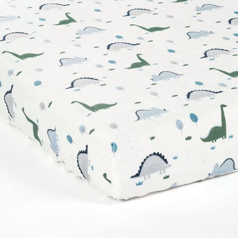 The adorable dinosaur print on this Dinosaurs Roar Soft & Plush Fitted Crib Sheet is the perfect addition to your prehistoric themed nursery. The earthy colors are easy to coordinate and style. Soft plush fabric makes this decorative piece very comfortable for your little one. Dress your little adventurer's crib in this prehistoric themed fitted crib sheet. With a fun pattern of dinosaurs and trees, you'll have a blast decorating the rest of your space from this whimsical inspiration. The earthy colors used in this print are easy to coordinate with the rest of your nursery decor, and they are the perfect calming shades for a nursery. Your toddler will also enjoy this Dinosaurs Roar Soft & Plush Fitted Crib Sheet when you move them into a toddler bed. Complete your dinosaur themed nursery o Dinosaur Crib Sheets, Baby Dinosaur Nursery, Animal Nursery Theme, Toddler Cup, Toddler Beds, Dinosaur Nursery, Nursery Room Inspiration, Lush Decor, Themed Nursery