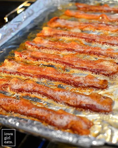 Want to know how to cook crispy bacon without all the muss and fuss? BAKE IT! You don't even need to preheat your oven! iowagirleats.com bacon in oven, bacon in the oven, baked bacon, baked bacon in the oven