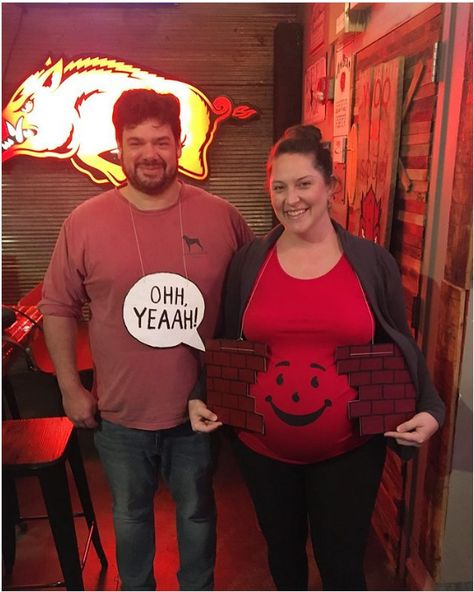 Best Pregnancy Halloween Costumes For Crafty Mothers-to-Be! 🎃 2024 Couple Halloween Costumes While Pregnant, Diy Pregnancy Halloween Costumes, Pregnant Belly Halloween Costumes, Pregnant Halloween Costumes Funny, Halloween Costumes For Pregnant Women, Pregnancy Halloween Costumes, Halloween Costumes Pregnant Women, Pregnant Couple Halloween Costumes, Costumes Pregnant