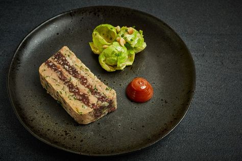 This fantastic terrine recipe makes the most of the colder months' quinces and sprouts – two wonderfully seasonal ingredients which provide perfect supporting acts to the rich, soft terrine. The terrine itself takes a few days to brine, cook and press, but it takes very little effort and will reward you with a wonderful starter to cook over the festive period. Pork Terrine, Salmon Terrine, Quince Jam, Terrine Recipe, Sous Vide Pork, Pork Shoulder Recipes, Blood Sausage, Sprout Salad, Great British Chefs