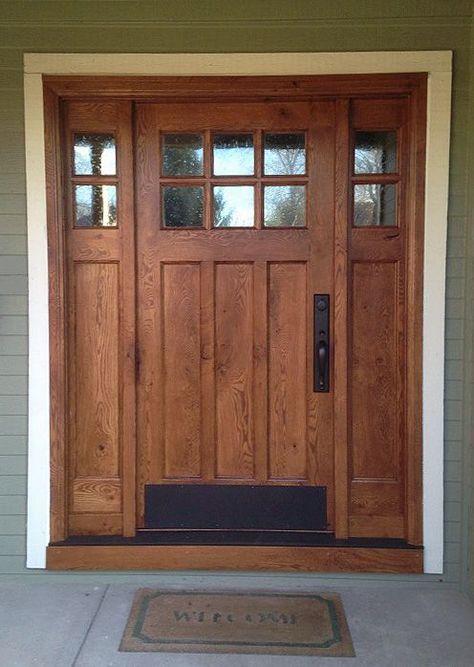 This Craftsman style door and sidelights, built of rustic white oak, features flat panels and upper divided lights.  Decorative seedy glass complements the style and allows natural light into the entryway. Craftsman Front Door, Craftsman Front Doors, Wooden Front Door, Craftsman Style Doors, Rustic Entry, Rustic Front Door, Exterior Doors With Glass, Farmhouse Front Door, Wood Front Doors