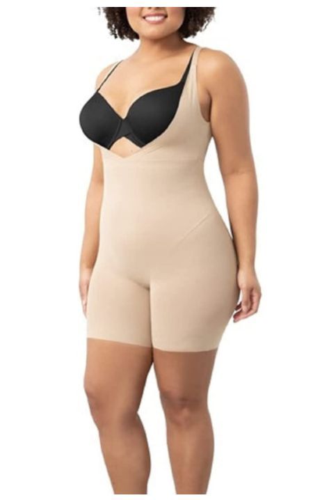 78% Nylon, 22% Elastane Imported Pull On closure Hand Wash Only TUMMY, HIP & THIGH TARGETING – Slip on instant curve appeal in this Maidenform shapewear firm-control body shaper that hugs you in all the right places, from bra line to mid-thigh. It shapes your tummy, waist, and back without pinching or squeezing. Shape Wear, Women Best, Gym Tops, Women's Wear, Women's Shapewear, Body Shaper, Body Shapers, Women Tops, Racerback Tank Top