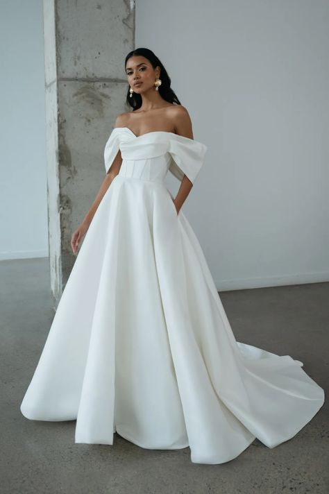 Jenny Yoo Bridal Spring 2025 Collection [PHOTOS] Sheri Hill Wedding Dresses, Wedding Dresses All White, Best Wedding Dresses Off Shoulder, Timeless Aline Wedding Dress, Over The Shoulder Wedding Dress Simple, Wedding Off The Shoulder Dress, Zavana Bridal Wedding Dresses, Chic Classy Wedding Dress, Dramatic Sleeves Wedding Dress