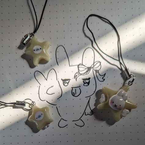 silly little stars ^^ (they glow in the dark :3) . . . . tags :D #mamegoma #shirogoma #clay #polymerclay #smallbusiness #depop #depopseller #phonecharm #charm #phonestrap #kawaii #miffy #clayart #art #claysculpture #clayartist #doodle #sketch #sketchbook #drawing Snoopy Clay Charm, Kuromi Clay Charm, Studio Ghibli Clay Charms, Sanrio Polymer Clay Charms, Anik Anik, Studio Ghibli Phone Charm, Clay Inspo, Clay Craft, Doodle Sketch