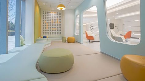 Sightour Ophthalmic Hospital, Hangzhou - M Moser Associates Bright Colored Furniture, Medical Facility, Hangzhou China, Children Hospital, Storefront Design, Hospital Interior, Pharmacy Design, Hospital Interior Design, Futuristic Interior