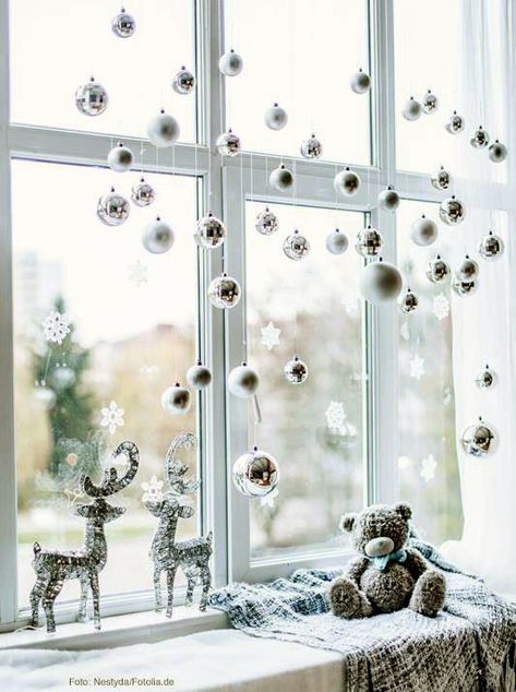 silver and white ornaments, snowflakes and deer will isntantly make your window look like Christmas Xmas Ornaments Diy, Window Decoration Ideas, Christmas Window Decor, Christmas Window Lights, Window Lights, Christmas Window Decoration, Hanging Candle Lanterns, Eid Decor, Front Door Wreaths